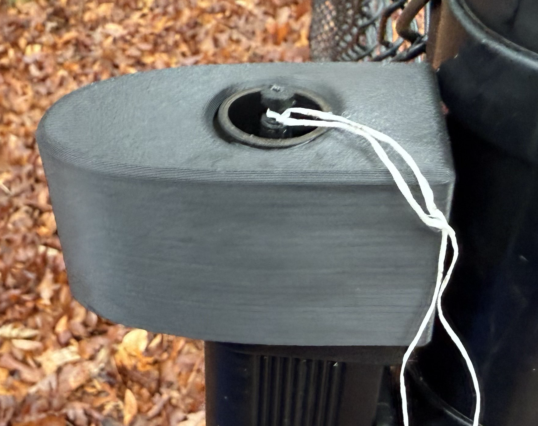 Dental floss threaded through the replacement knob hole