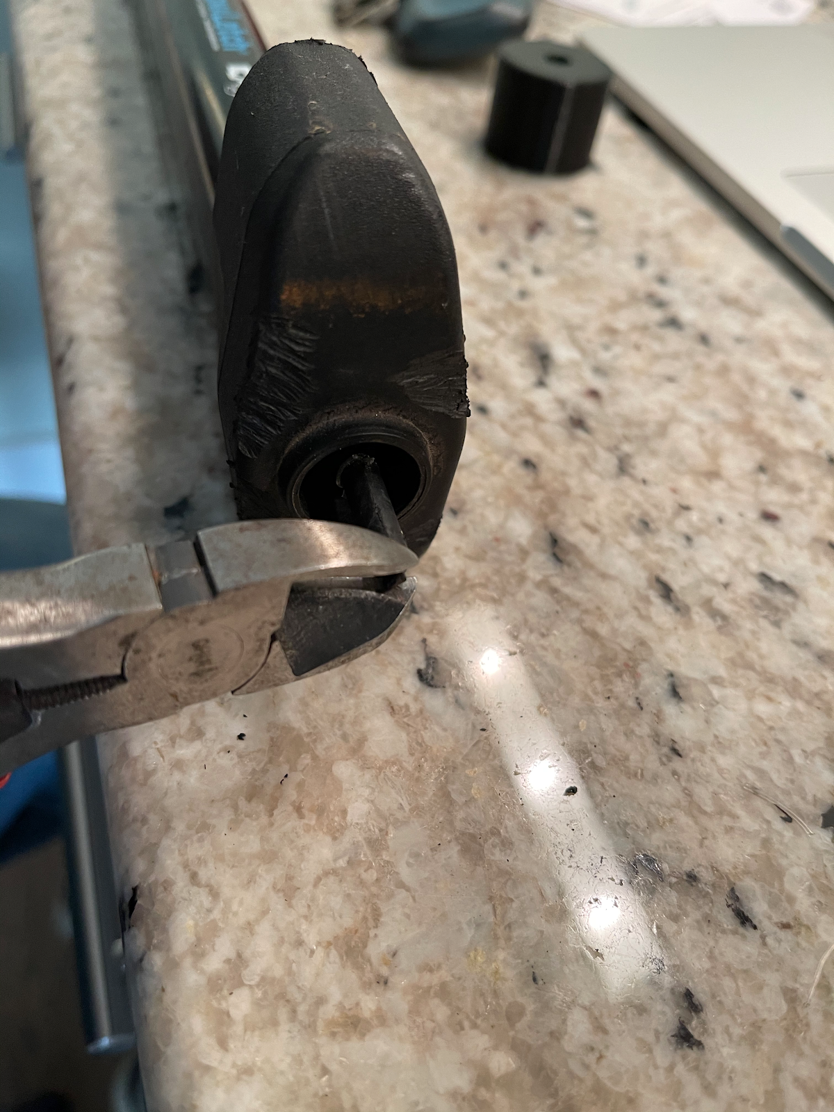 Clipping off the damaged end of the shaft