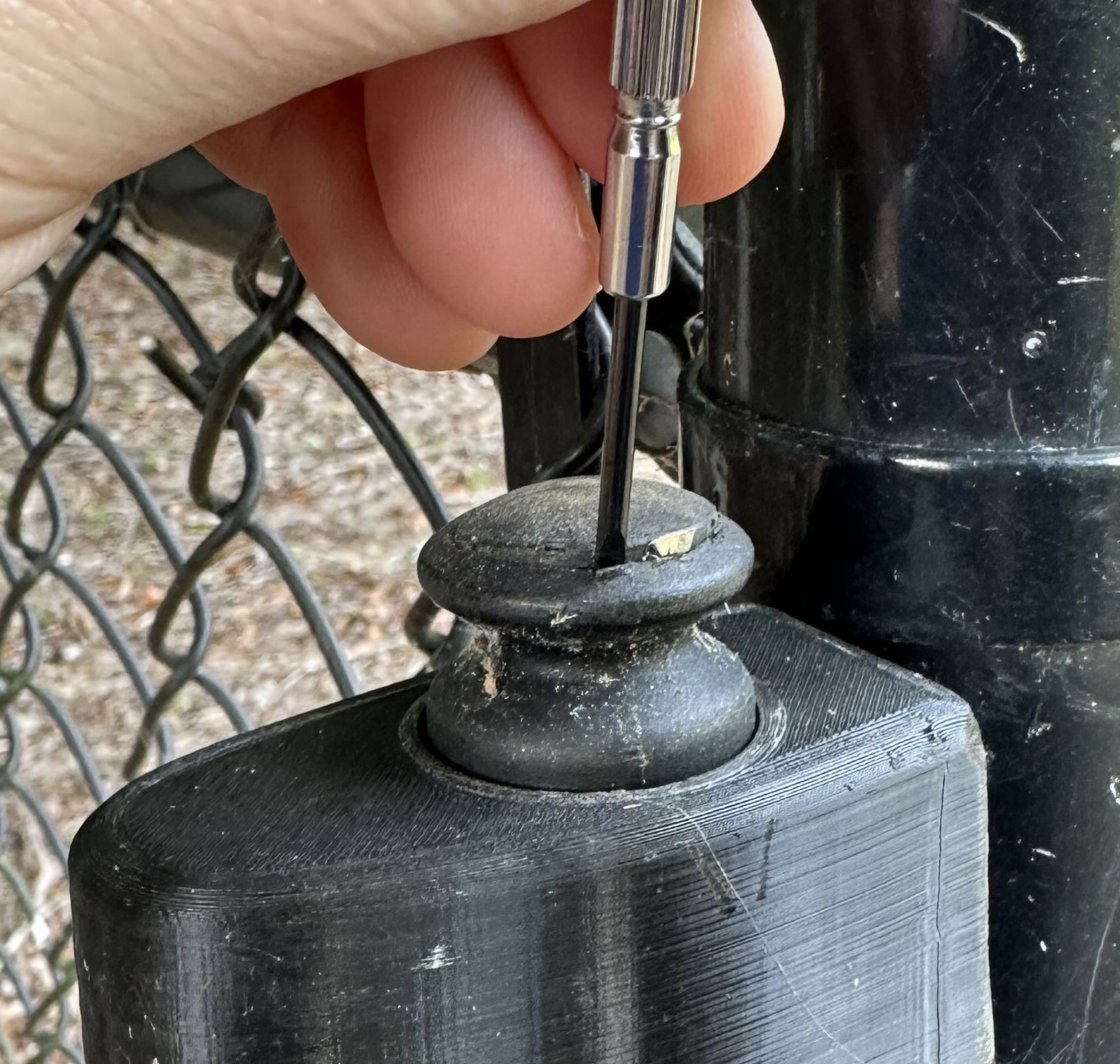 Using a screwdriver to pop the remaining cap off a damaged V2 knob
